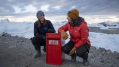 Kirsten Shaw and Aurelia Reichardt, station leader at Rothera, are pictured with the new post box.