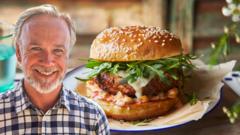 A photo of Marcus Wareing edited onto a photo of a pork burger.