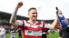 Veteran striker Sharp signs new Doncaster deal