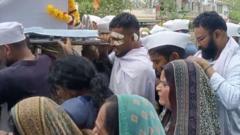 Lone Air India survivor carries coffin of brother killed in crash