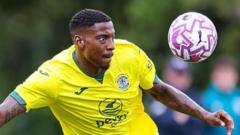 MK Dons sign Hibernian defender Ekpiteta