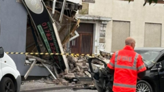 Man in hospital after car crashes into takeaway