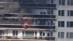 Watch: Man seen climbing from balcony during Antwerp fire
