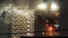 Man dies after falling from window during tower block fire