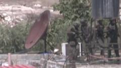 Israel investigates after its soldiers filmed throwing bodies off roof