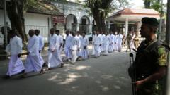 Sri Lankan Special Task Force officer stands guard as prisoners leave from Supreme Court complex on November 13, 2018 in Colombo, Sri Lanka. Security is tight around President Secretariat office and Supreme Court while hearing the Fundamental Right petitions in the court challenging the dissolution of Parliament
