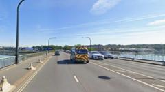 Two arrested after biker dies in crash on bridge