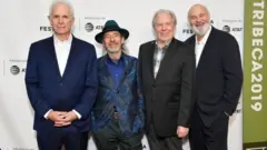 Harry Shearer (middle left) alongside Rob Reiner (right) and the cast of