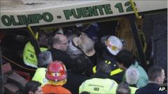 A wounded passenger is carried out the wreckage in Buenos Aires, Argentina