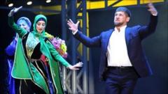 Chechen leader Ramzan Kadyrov (right) dances during the party in Grozny 5 Oct 2011