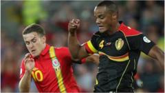 Wales captain Aaron Ramsey challenges Belgium captain Vincent Kompany