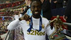 Nathan Dyer collects his man-of-the-match award
