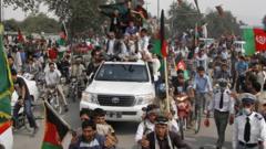 Afghans welcome their national football team a day after they beat India 2-0 in the South Asian Football Federation Championship in Kabul, Afghanistan, on 12 September 2013.