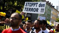 Marchers in Hannover, Germany, condemn violence against Iraqi minorities, 16 August