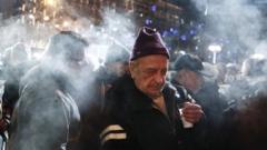 Pensioners receive free food as part of a night-long anti-austerity protest in Athens (10 December 2014)