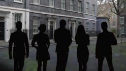 Shadows standing in front of 10 Downing Street