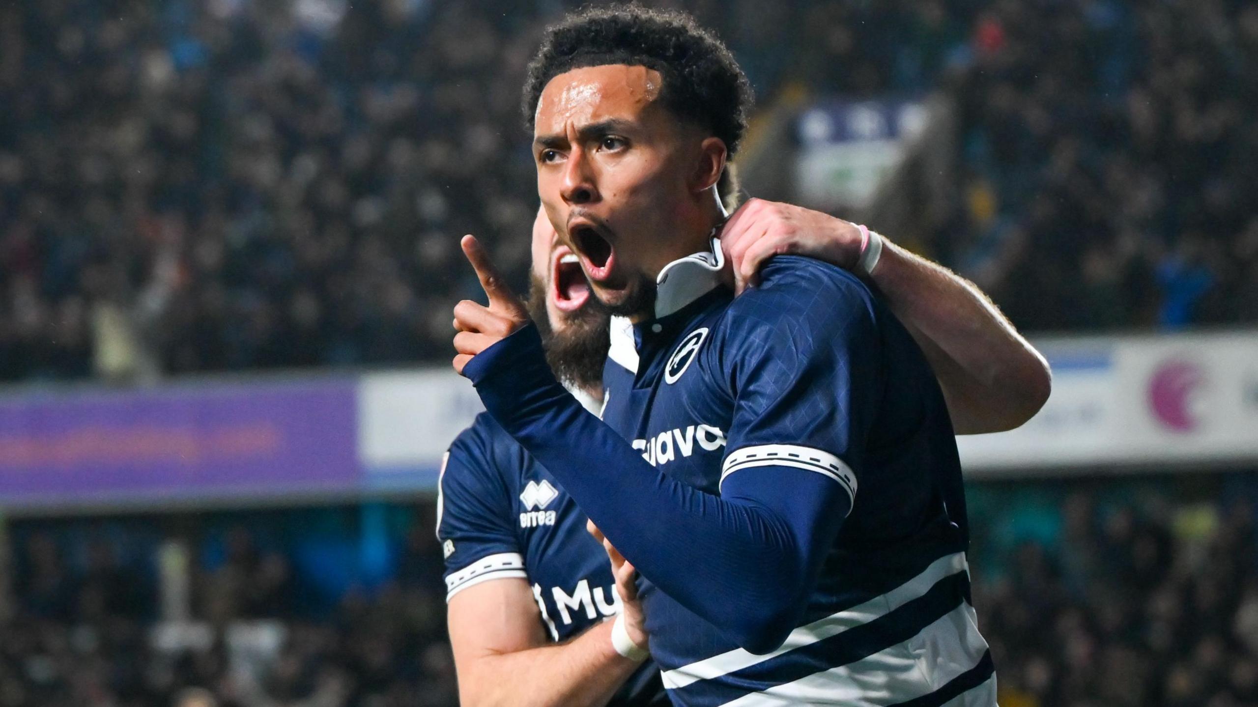 Femi Azeez celebrates after scoring a late equaliser for Millwall