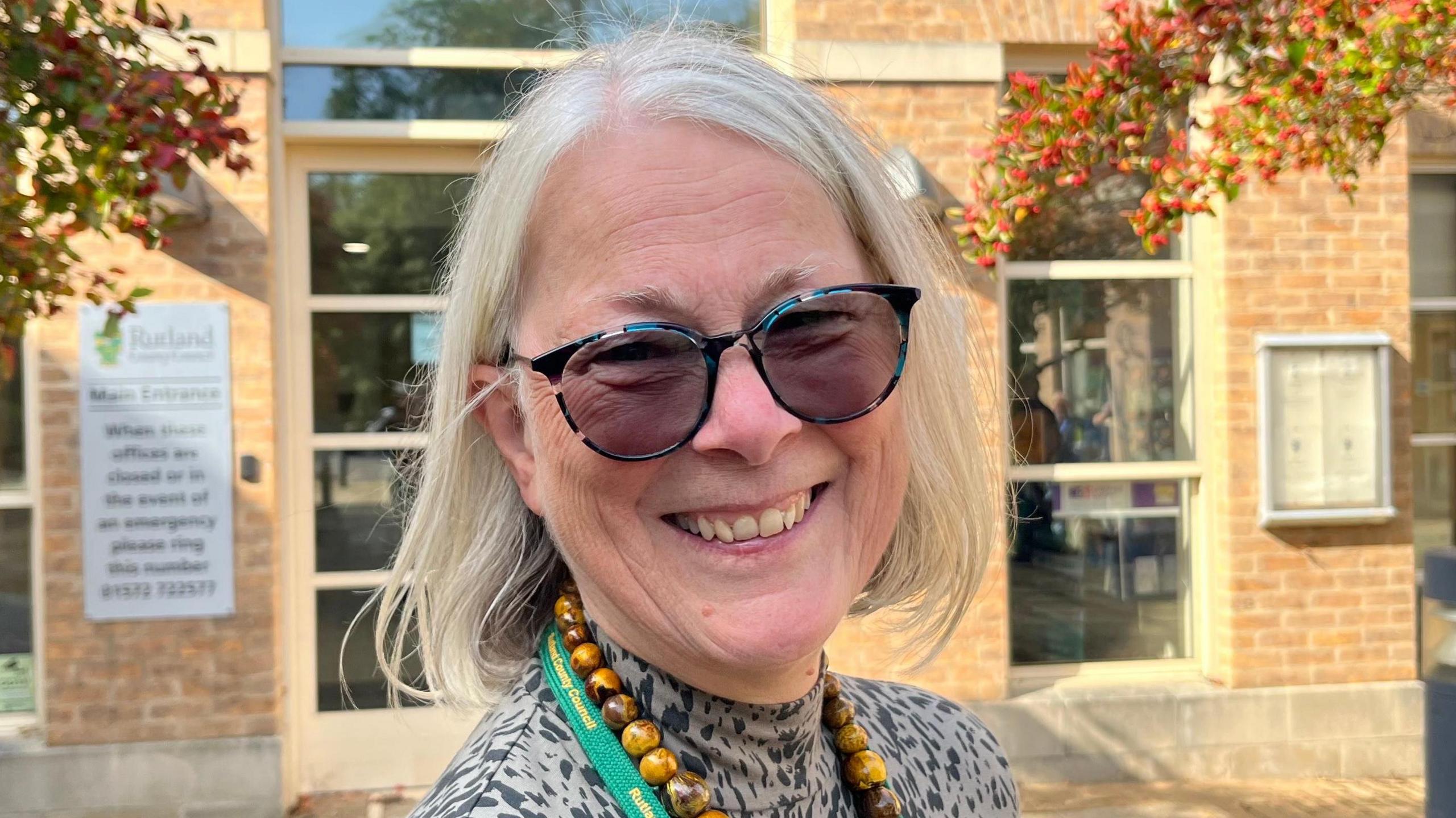 A portrait picture showing Christine Wise smiling at the camera.