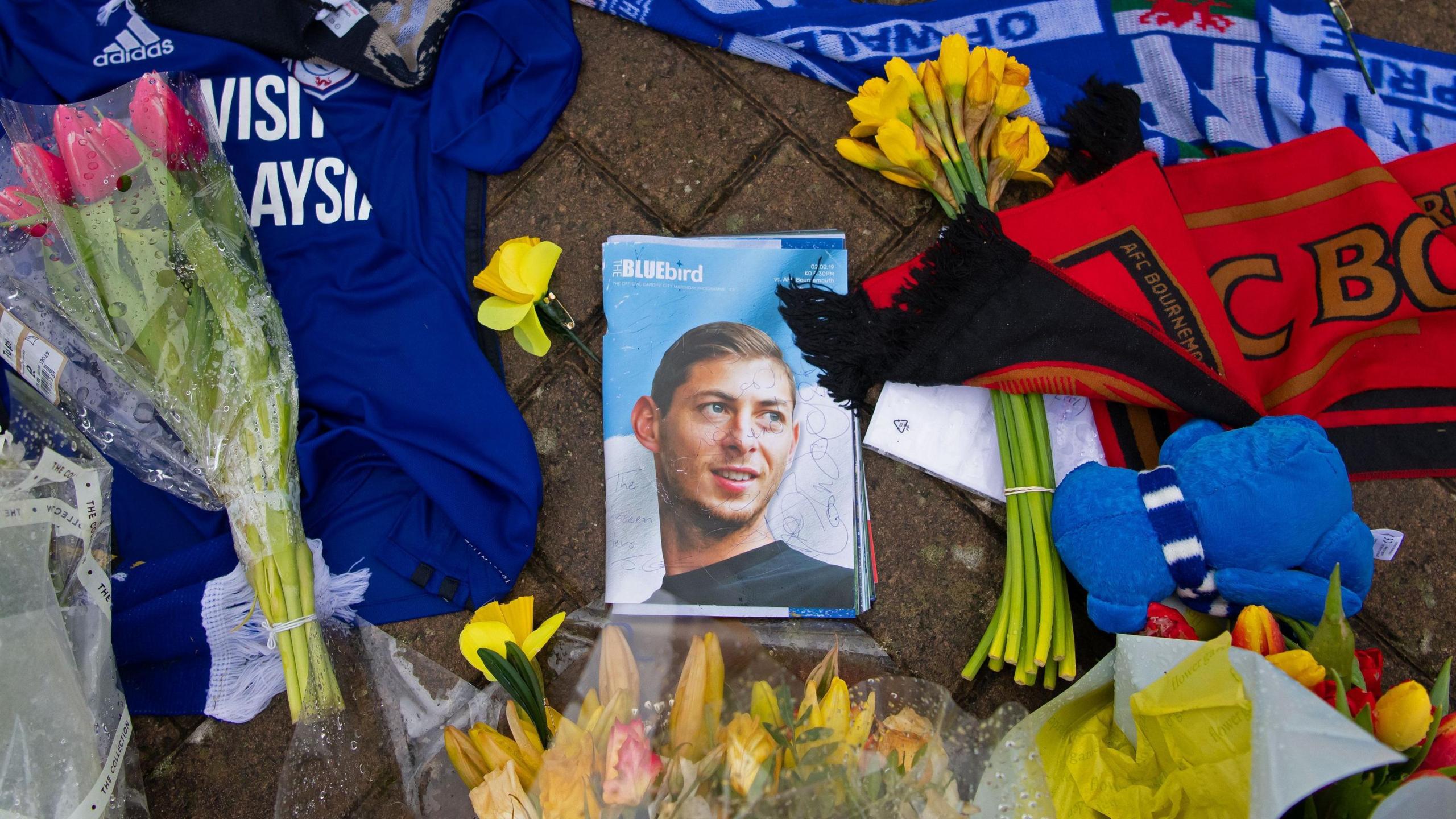 Flowers, shirts, scarves and a photo of Emiliano Sala left by fans outside Cardiff City Stadium following the striker's death