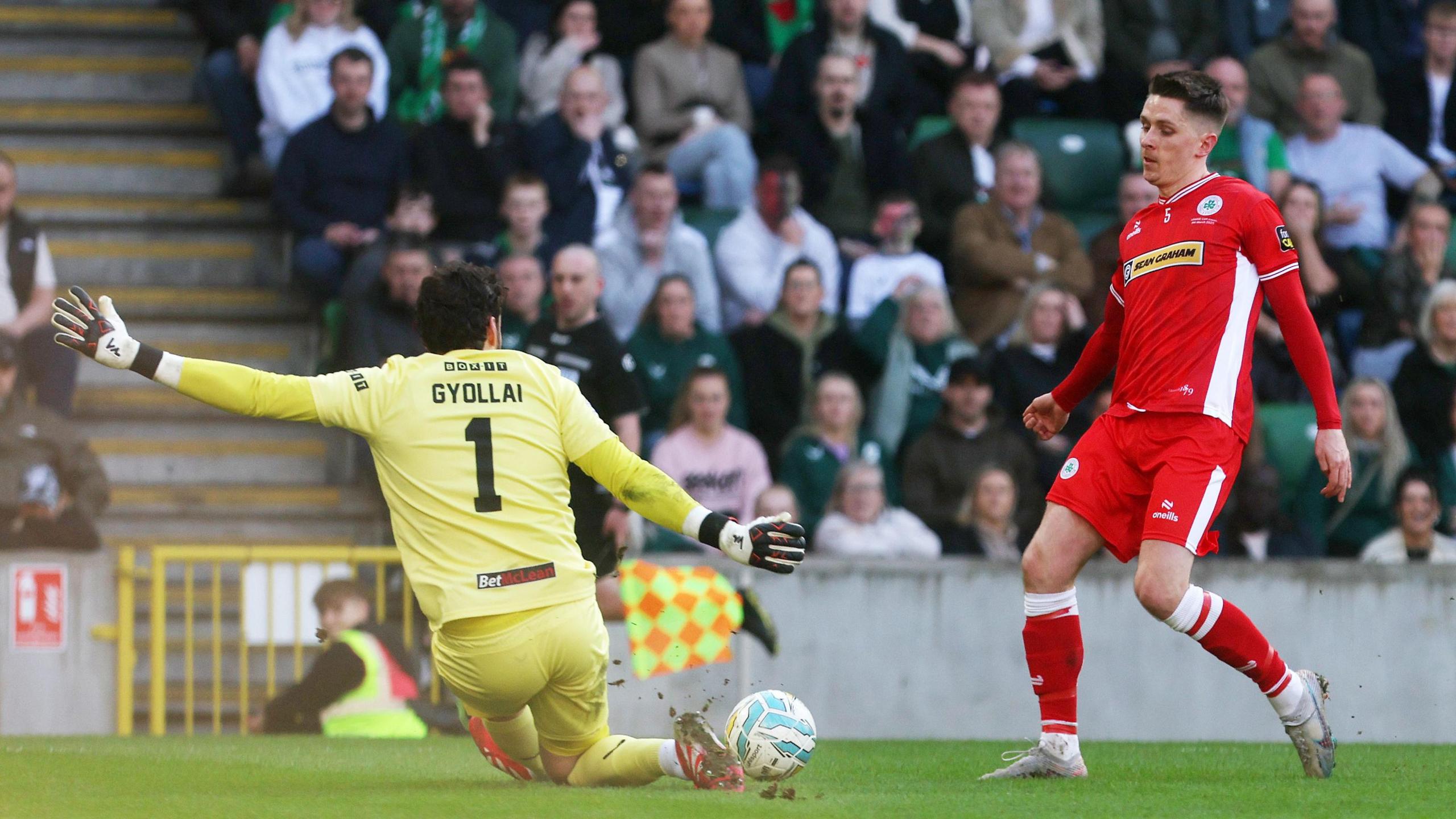 Ryan Curran's shot is saved by Daniel Gyollai