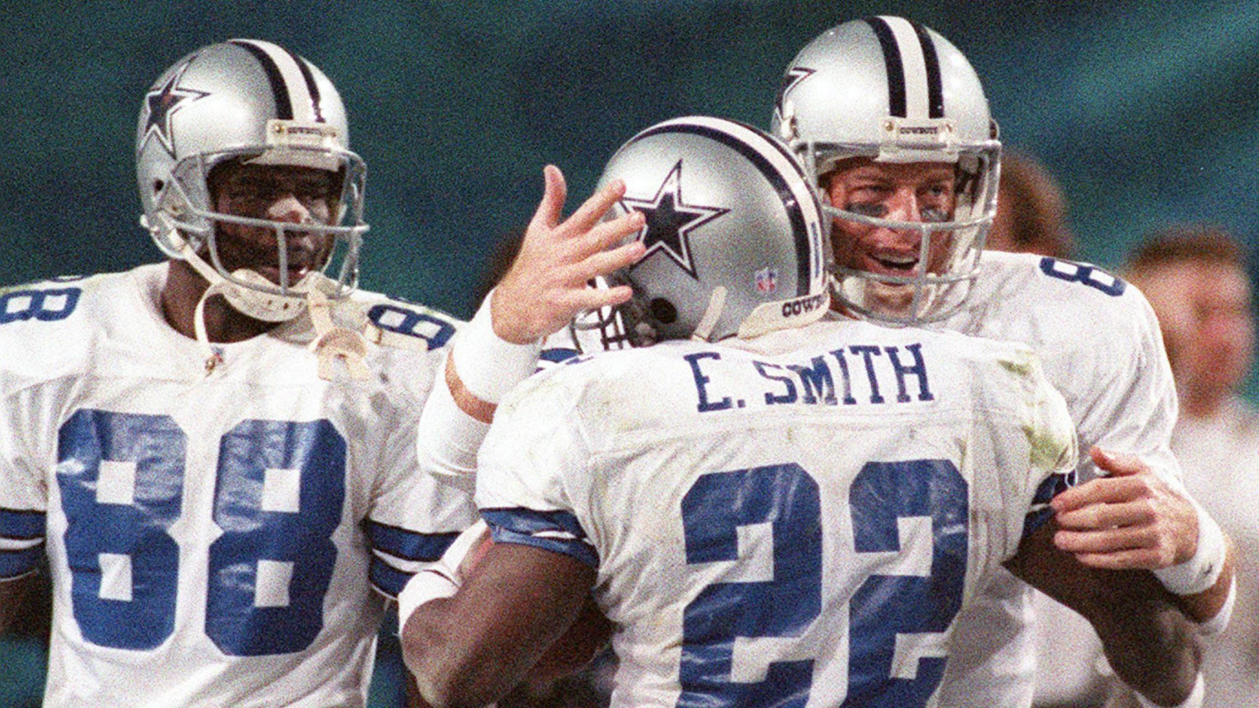 Dallas Cowboys superstars Troy Aikman, Emmitt Smith and Michael Irvin celebrate 