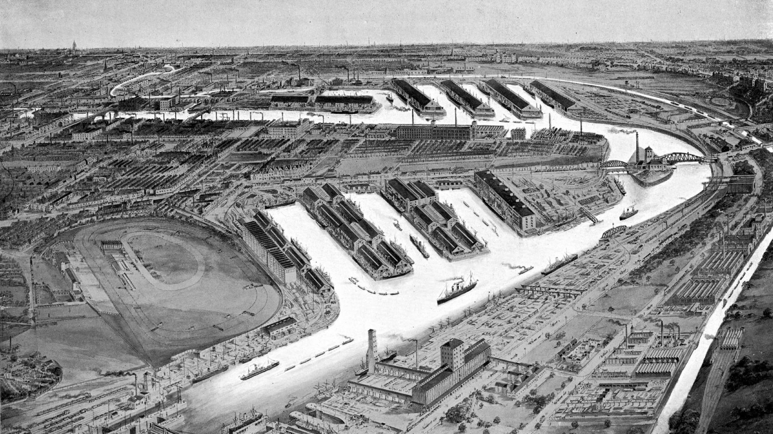Detailed black-and-white illustration from 1898 showing the Manchester Ship Canal and Salford Docks with multiple dock basins, warehouses, and industrial buildings, alongside the oval-shaped Manchester Racecourse in the foreground.