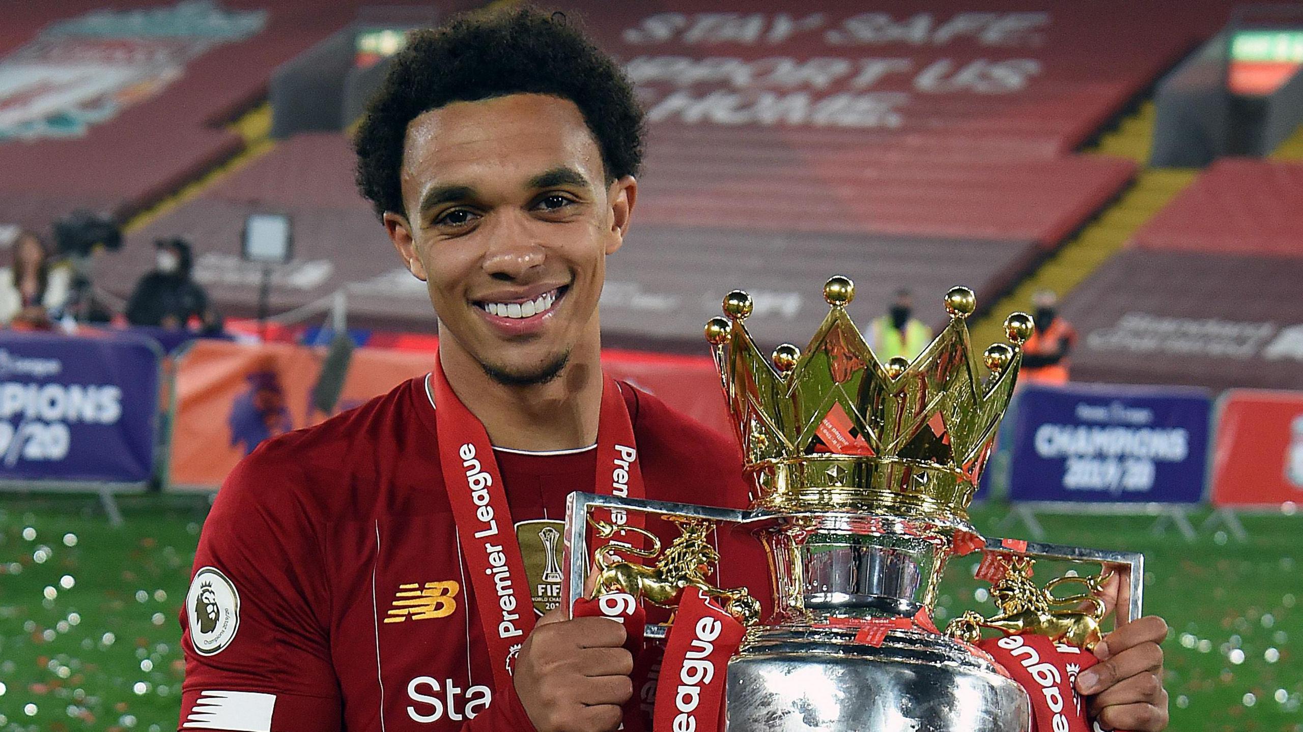 Trent Alexander-Arnold with the Premier League trophy after winning the title with Liverpool in 2020