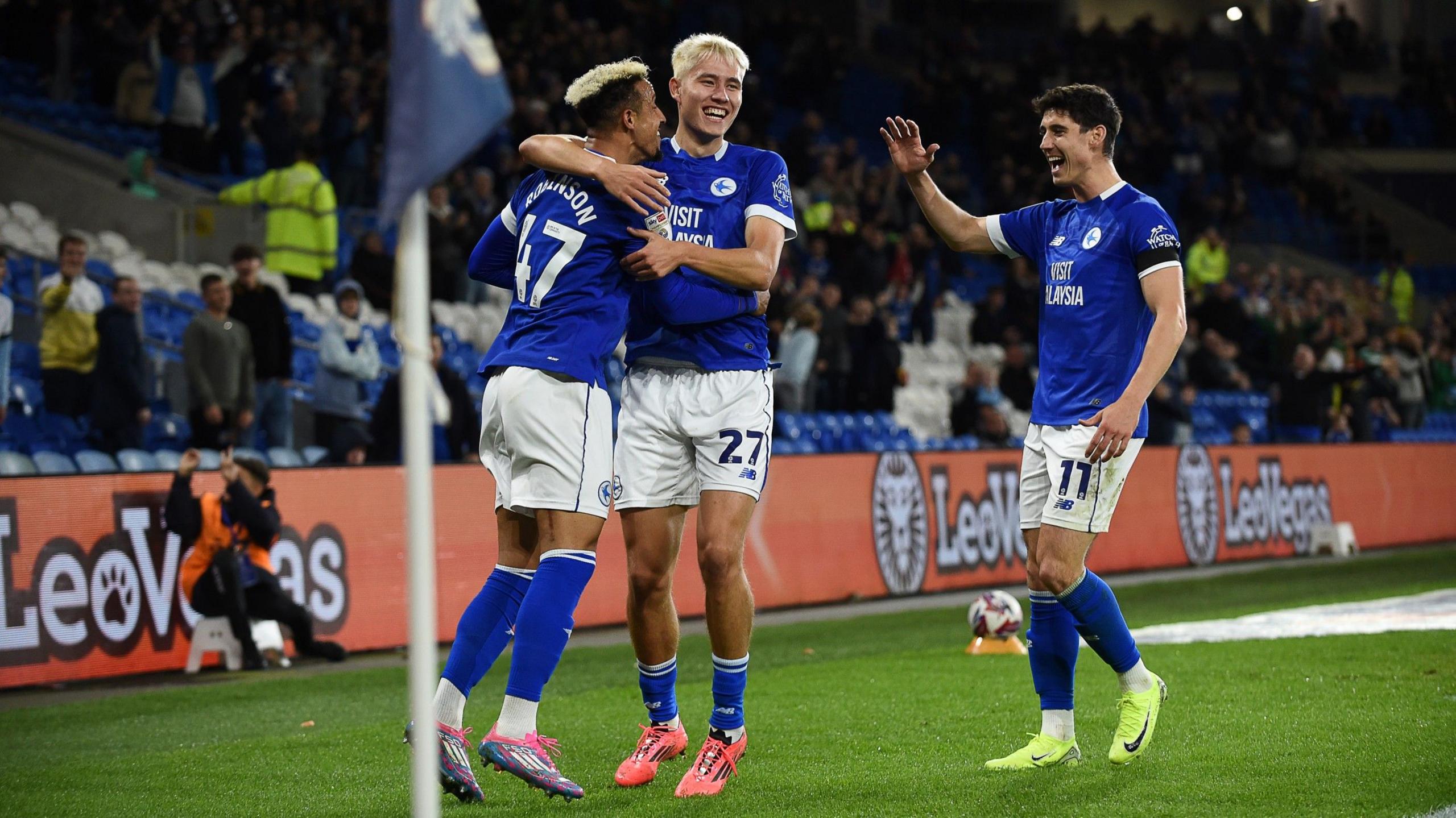 Cardiff City players Callum Robinson, Rubin Colwill and Callum O'Dowda celebrate