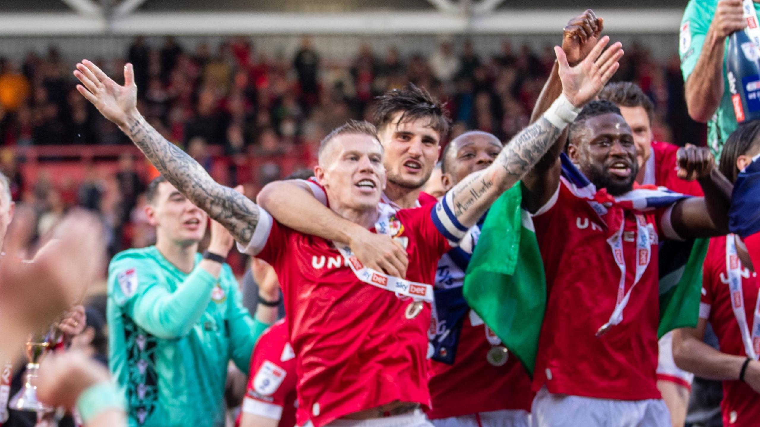 Wrexham captain James McClean celebrates