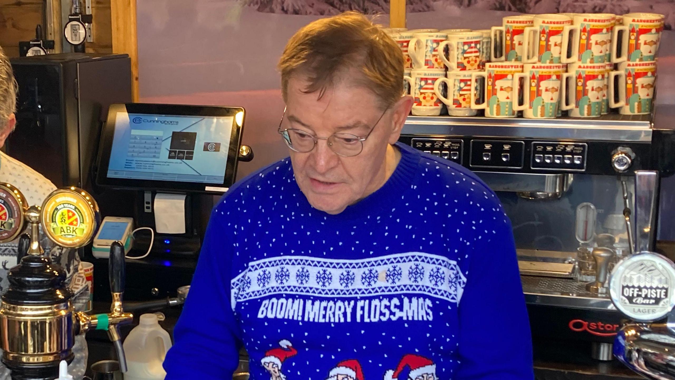 Councillor Pat Karney, dressed in his blue Christmas jumper