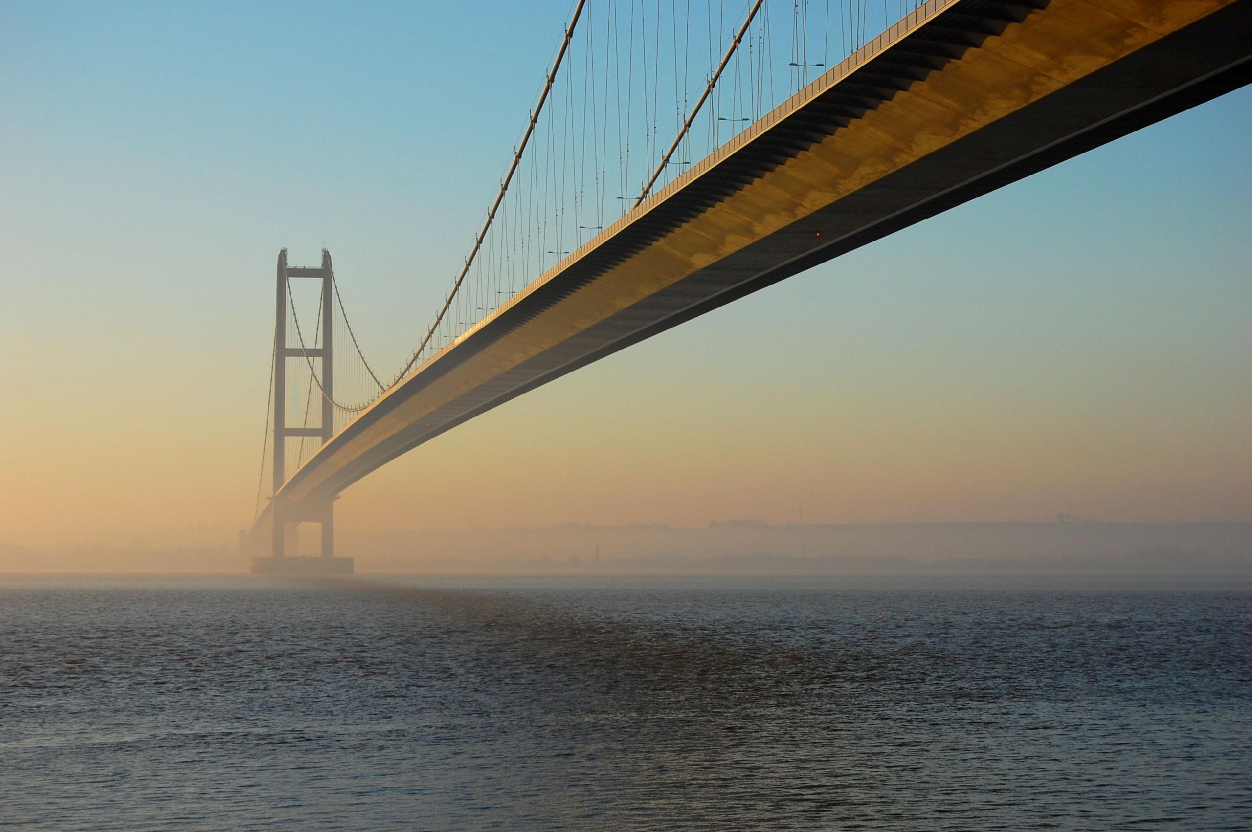 The view of the humber bridge from the north bank of the River Humber on a misty morning.