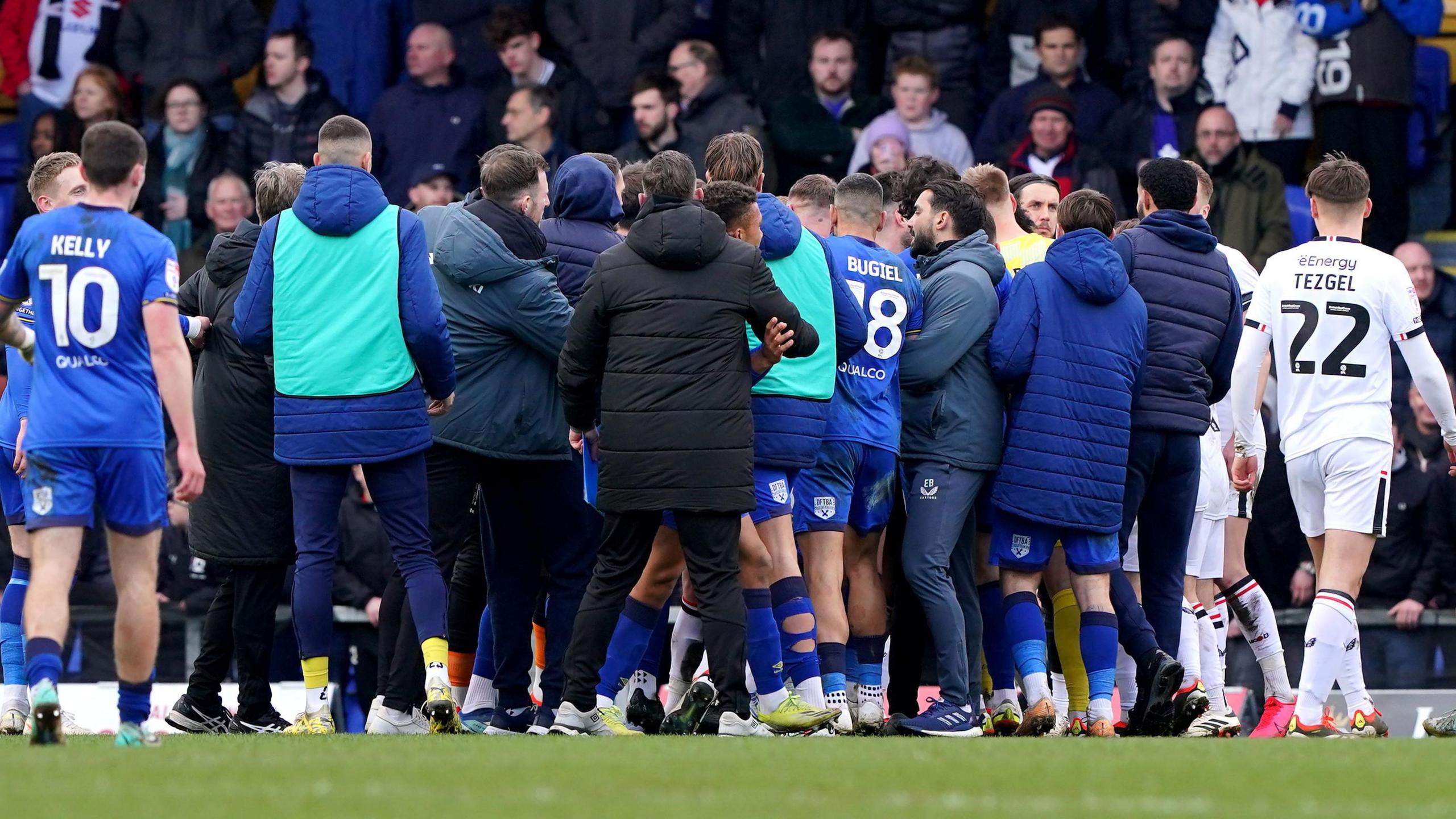 Players and staff from AFC Wimbledon and Milton Keynes Dons clashed after the final whistle