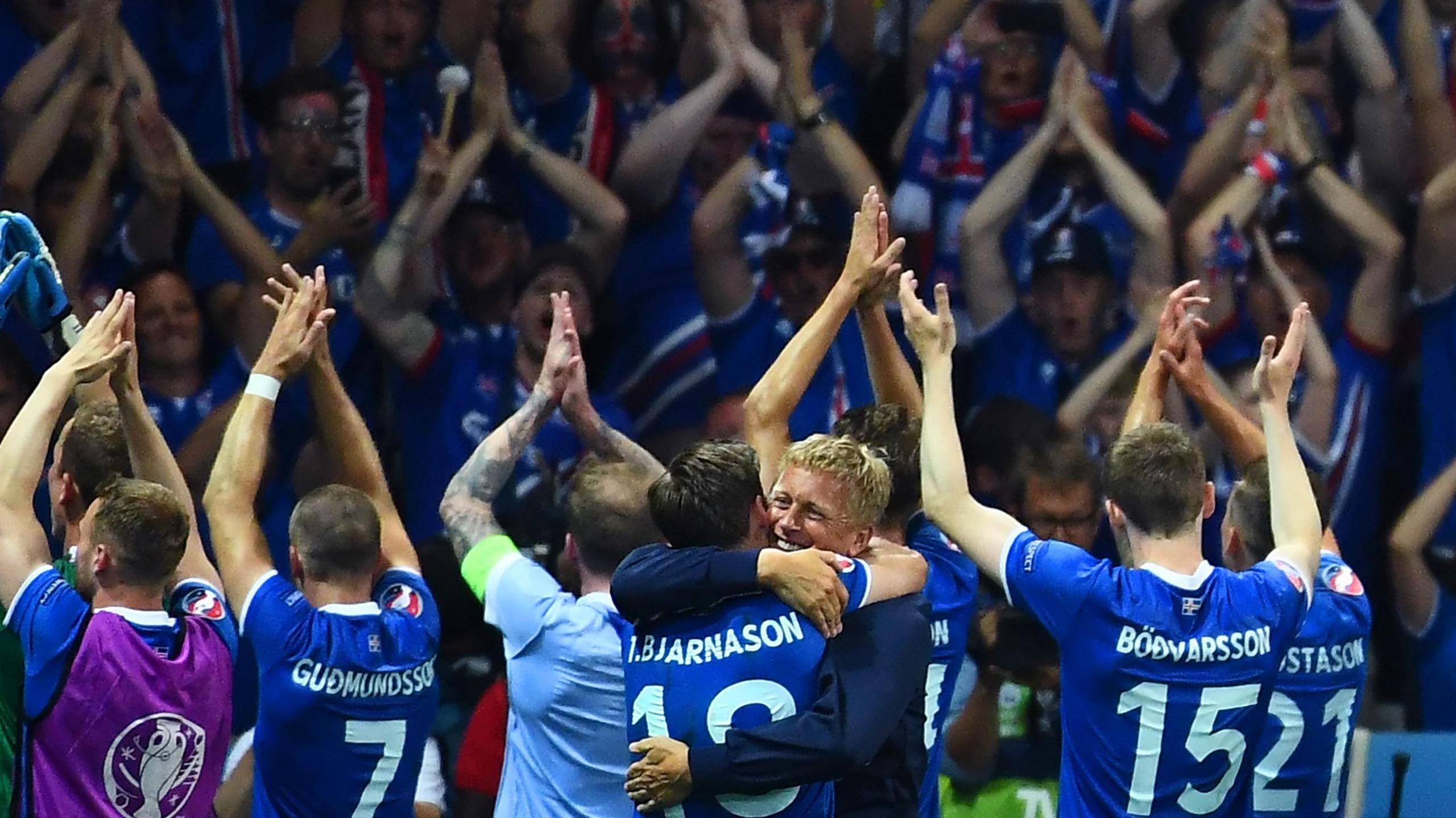 Iceland coach Heimir Hallgrimsson and his players celebrate after the Euro 2016 win over England