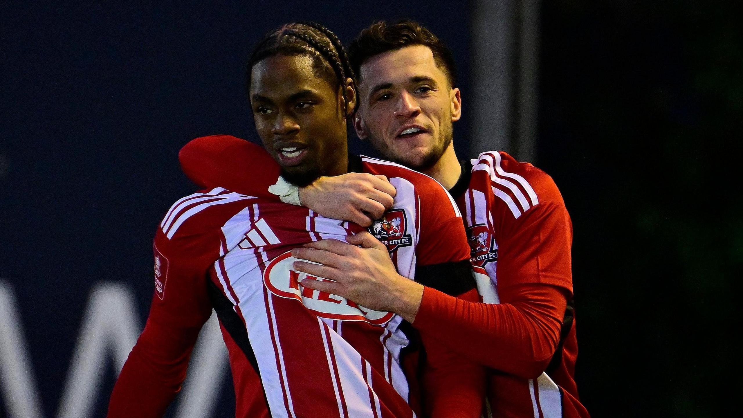 Exeter City players celebrate a goal