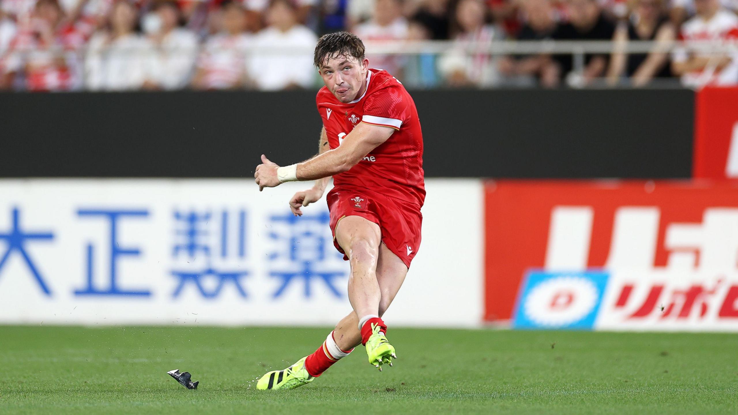 Wales fly-half Dan Edwards kicks at goal