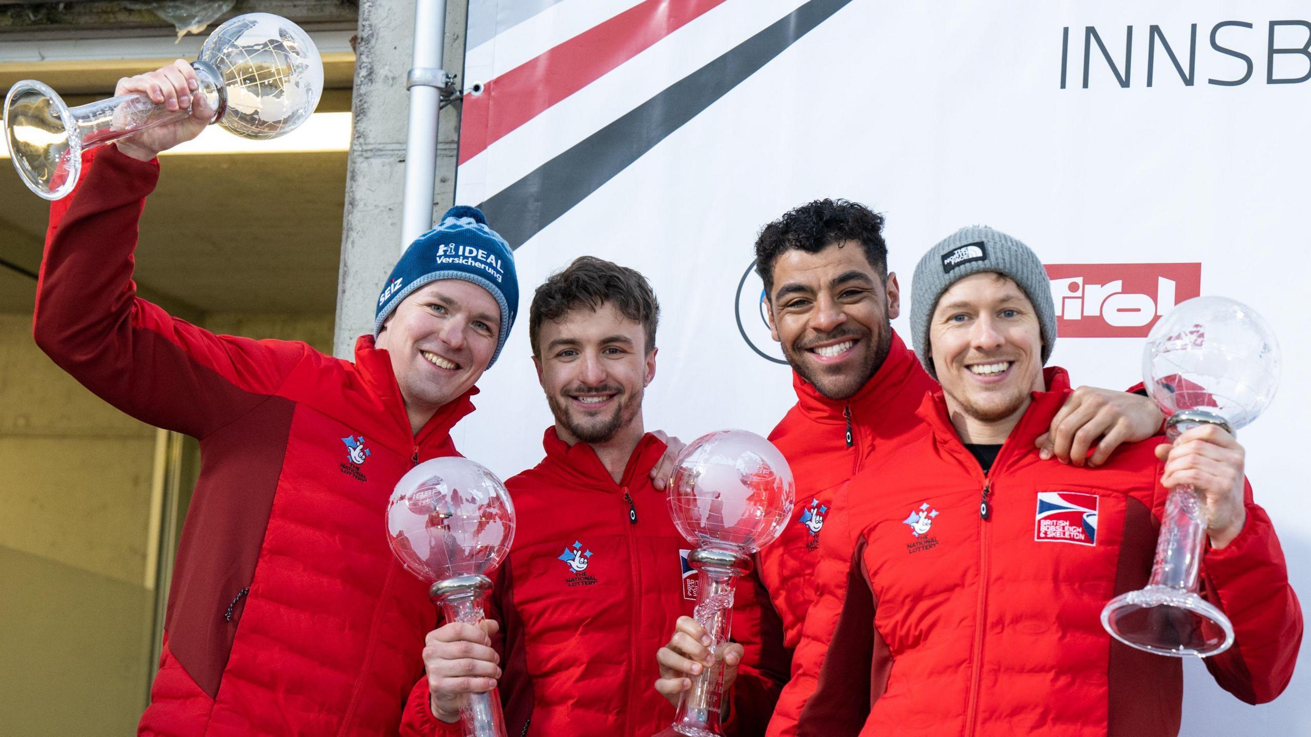 Brad Hall, Arran Gulliver, Leon Greenwood and Greg Cackett with their trophies after their gold at the 2023 IBSF European Championships in Altenberg