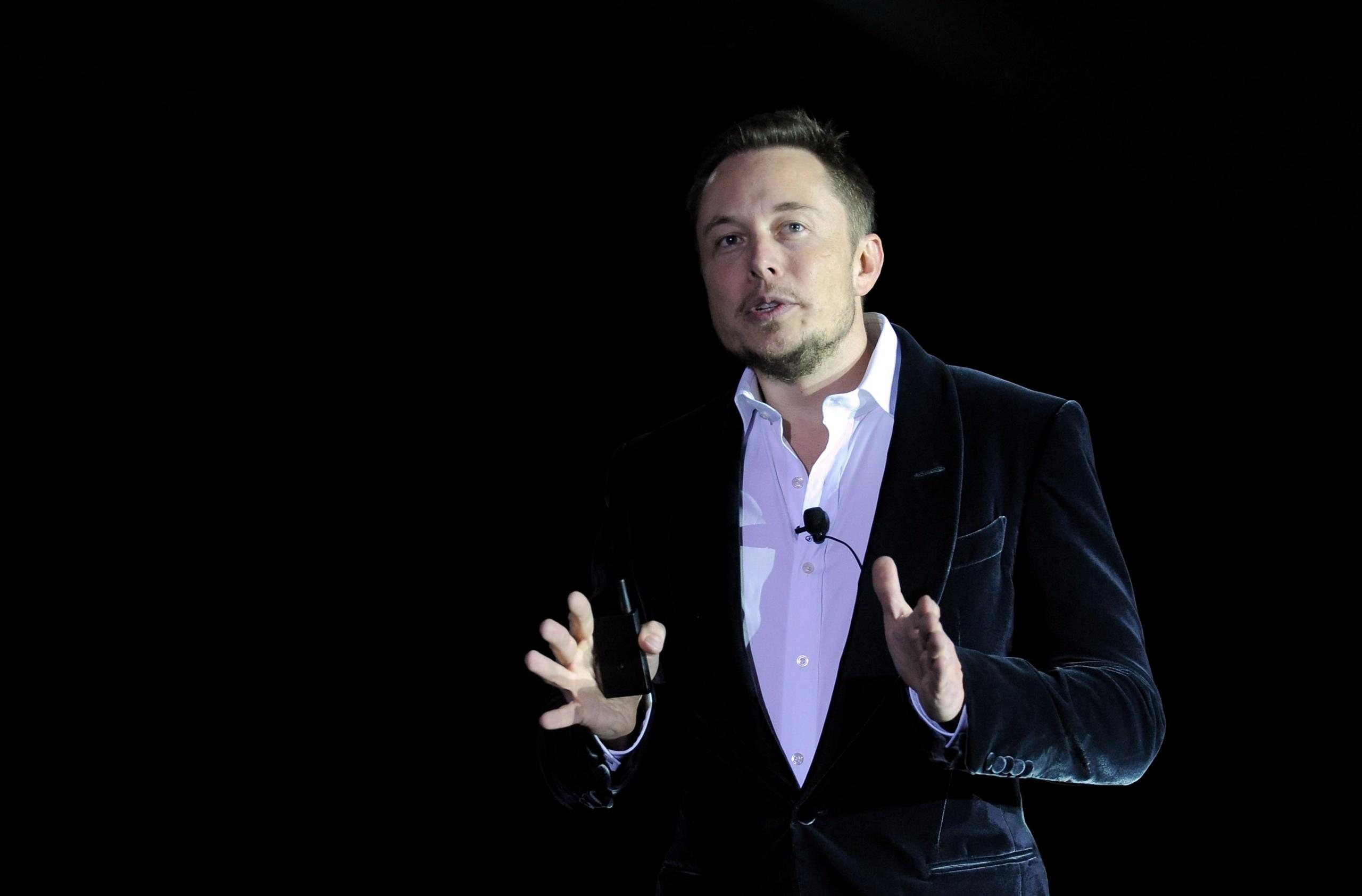 Elon Musk speaking on stage