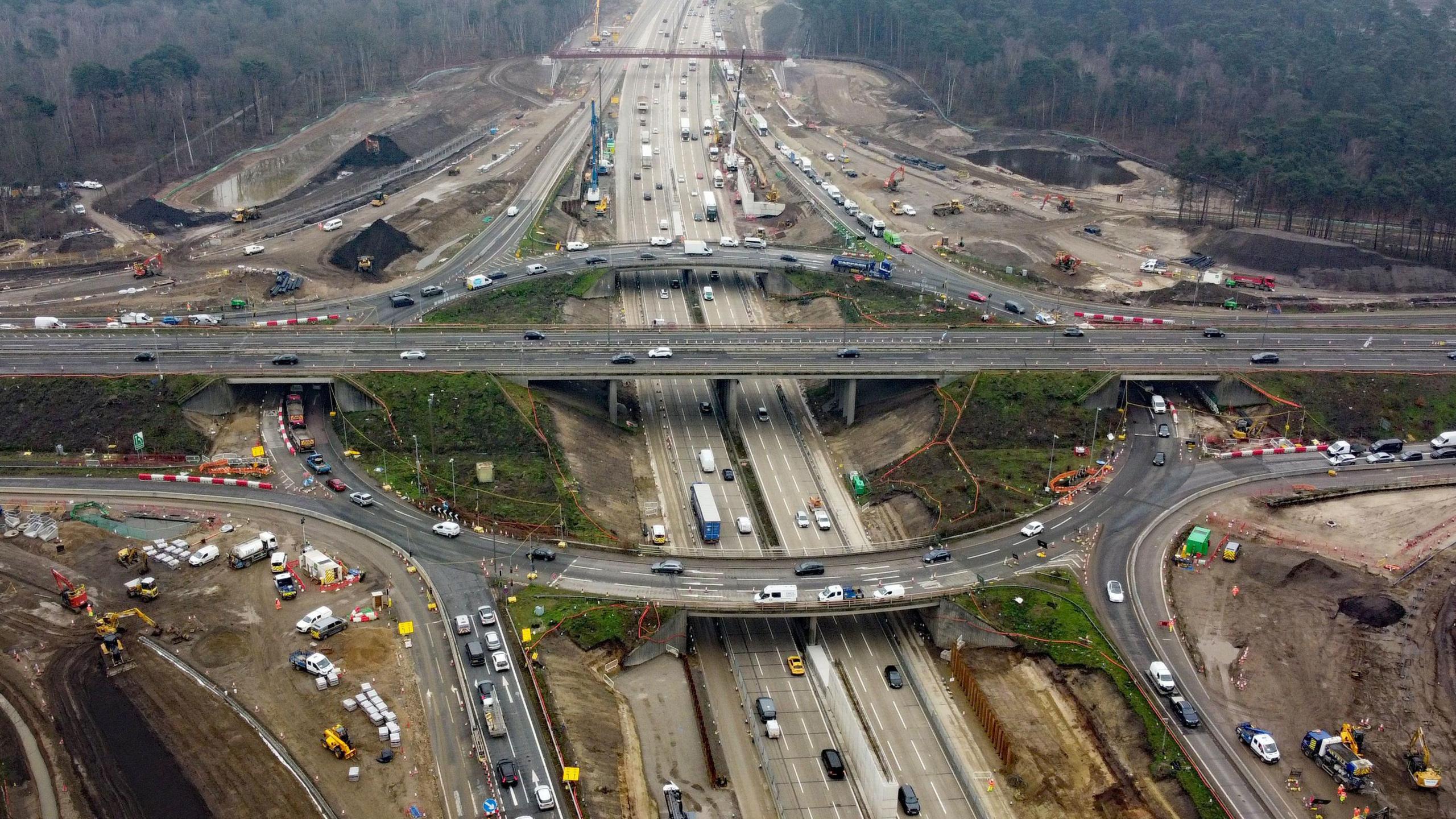 An aerial image of the M25 at junction 10 showing a huge roundabout and significant building work 