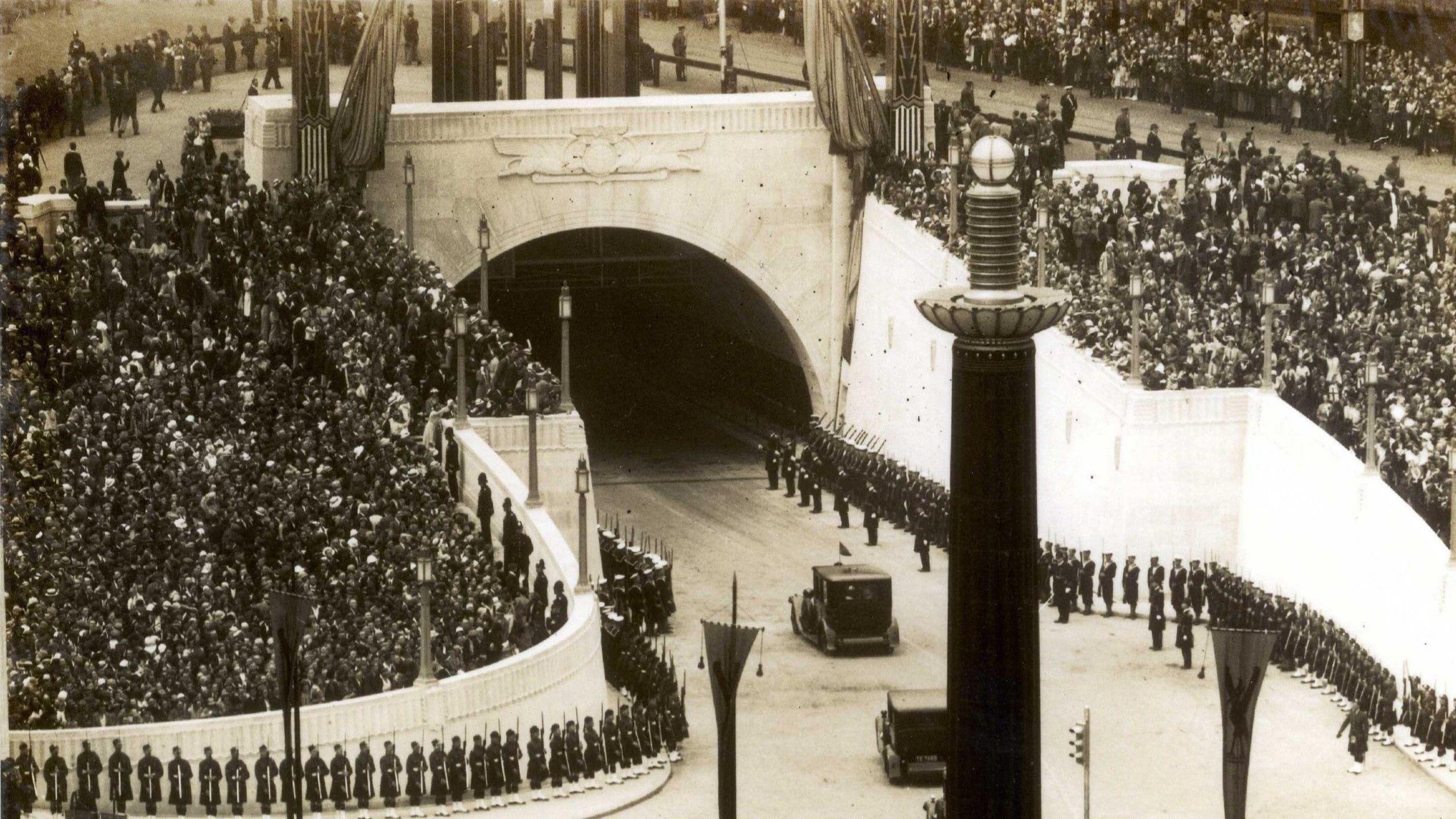 Crowds line the streets around the Queensway Tunnel entrance in 1934