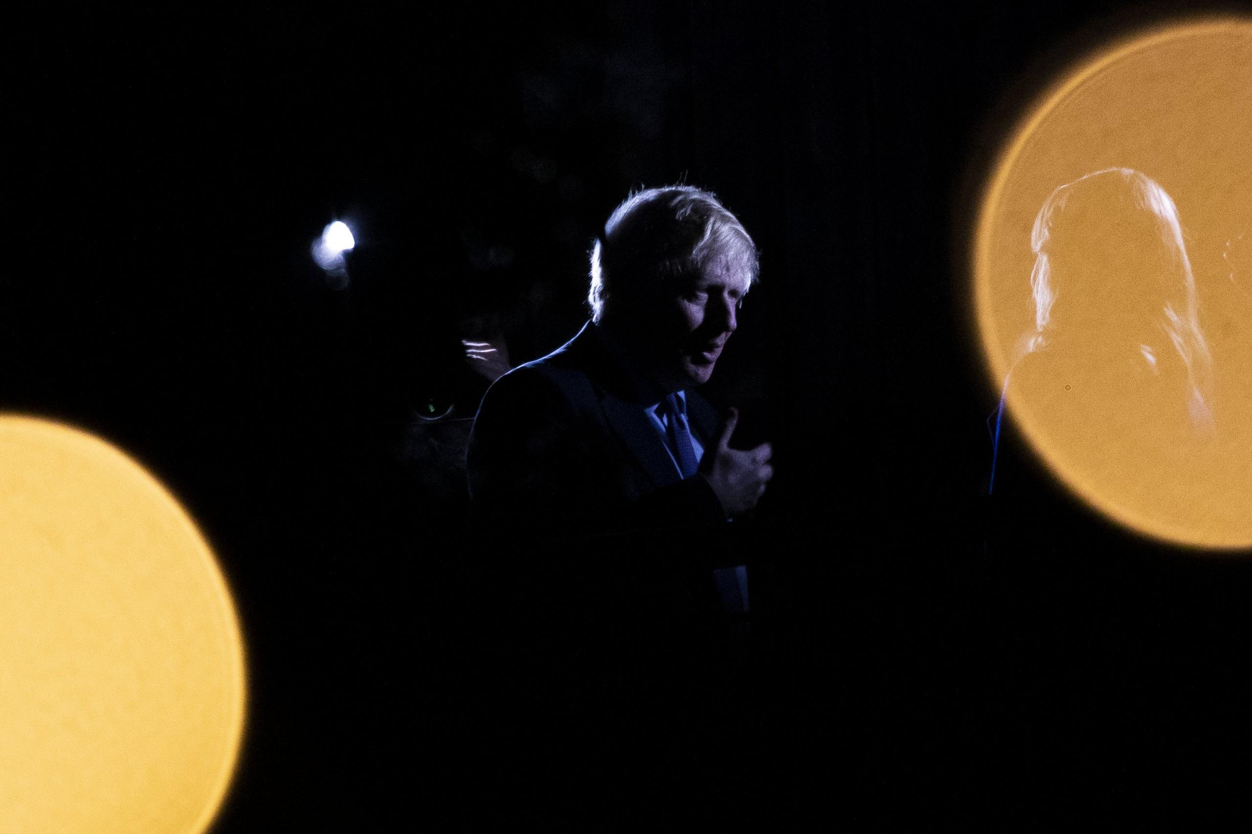 Boris Johnson is interviewed on a balcony as he visits Darts Farm Shopping Village in Topsham, Devon.