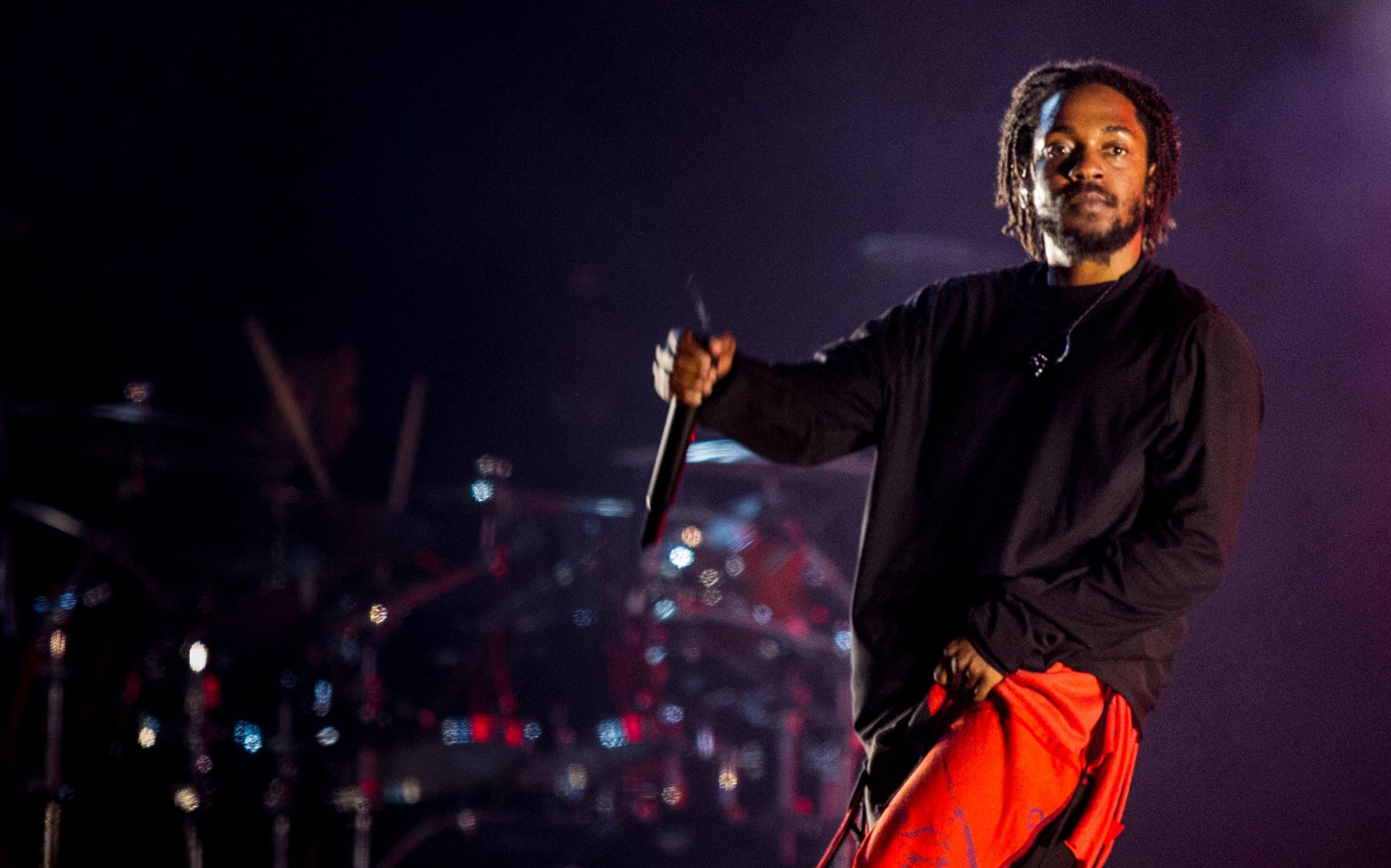 The rapper Kendrick Lamar is pictured onstage at a festival in Brazil. 