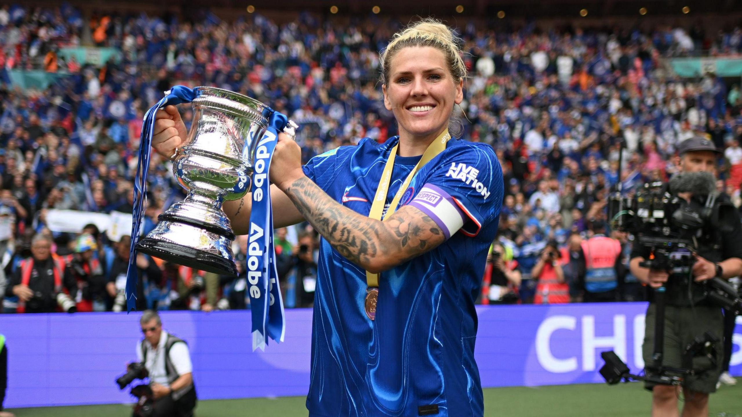 Millie Bright lifts the FA Cup