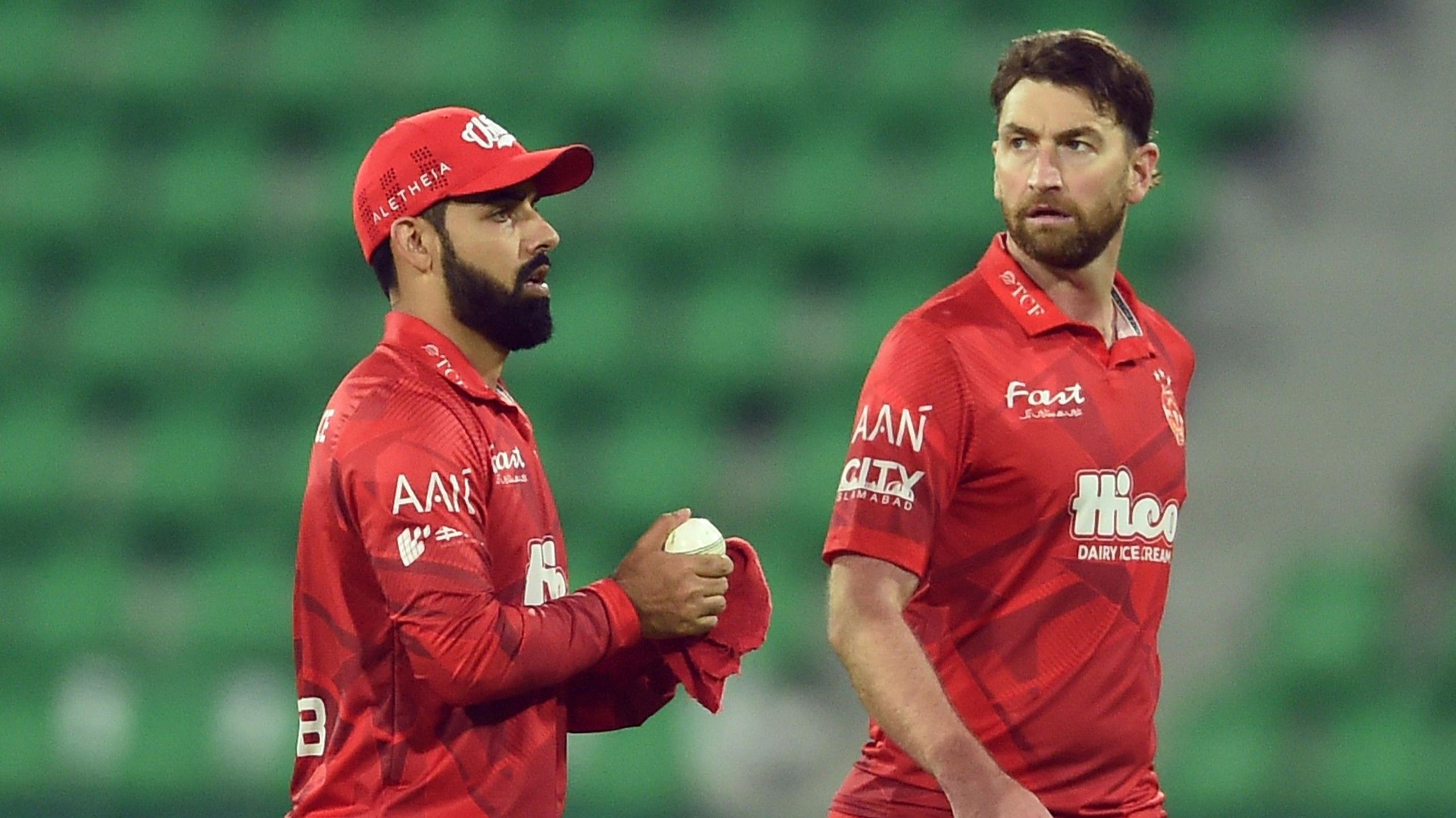 RIchard Gleeson looks on while wearing a red kit in the Pakistan Super League