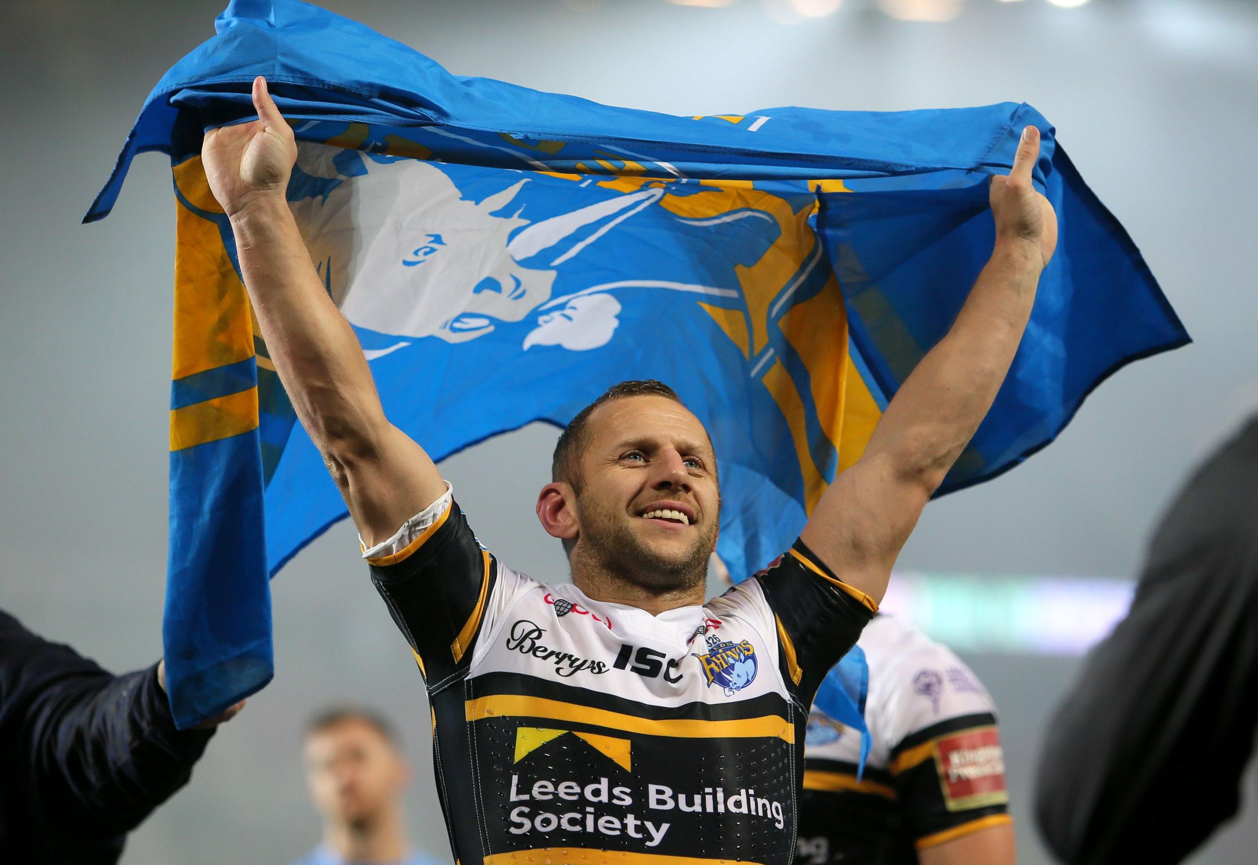 Rob Burrow holding up a flag