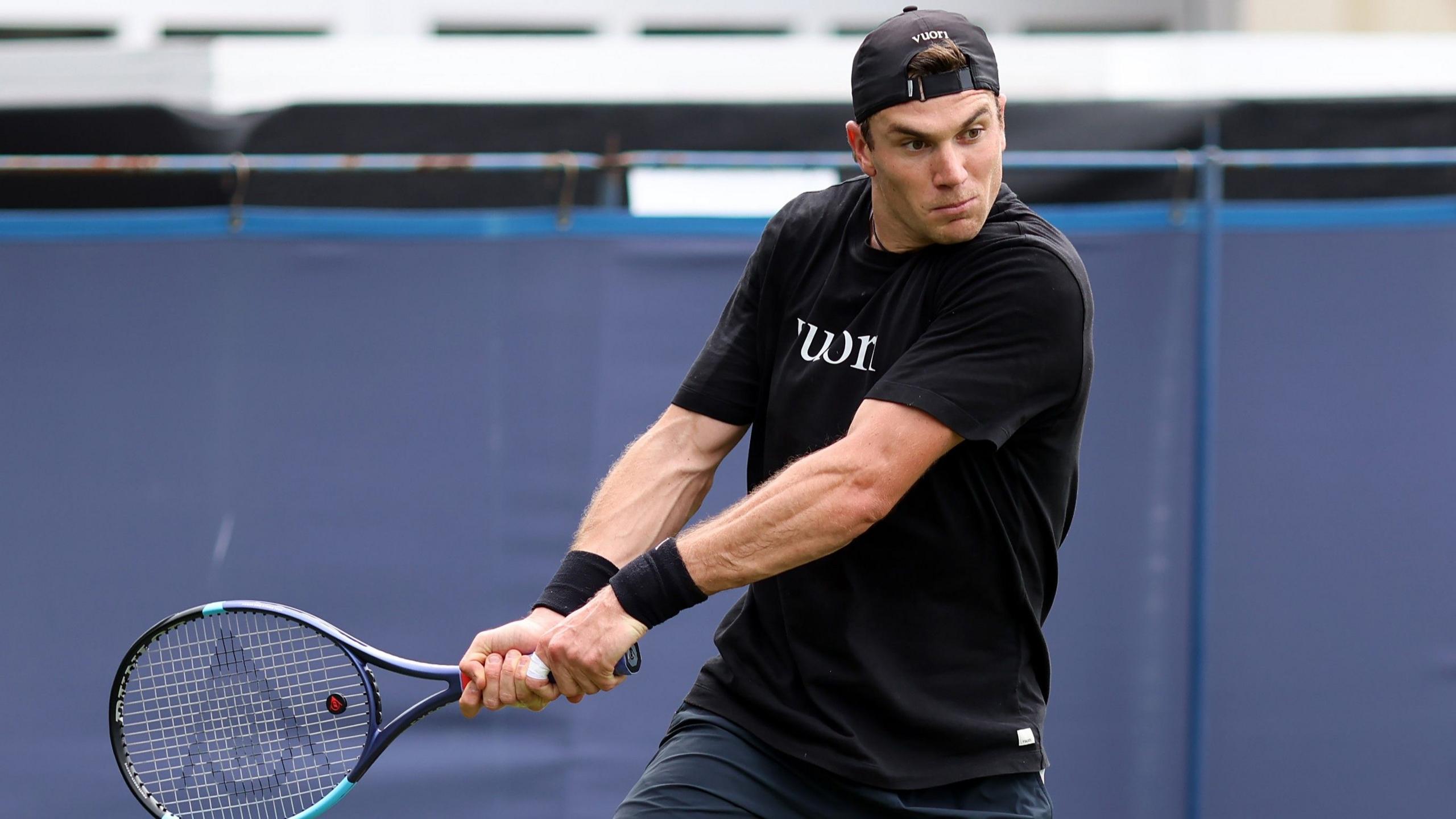 Jack Draper hits a backhand in a practice session at Eastbourne