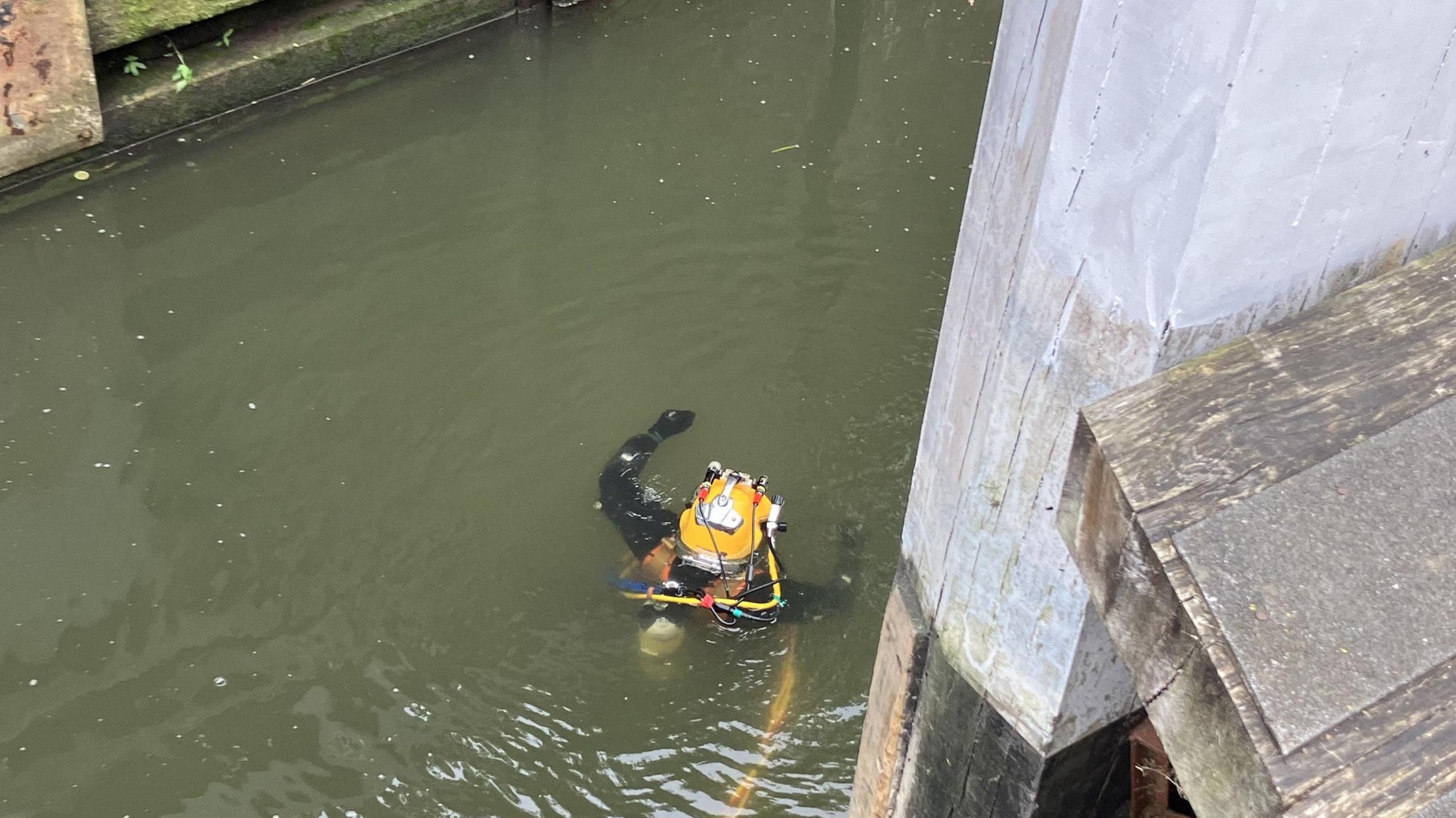 A diver in the water on the canal