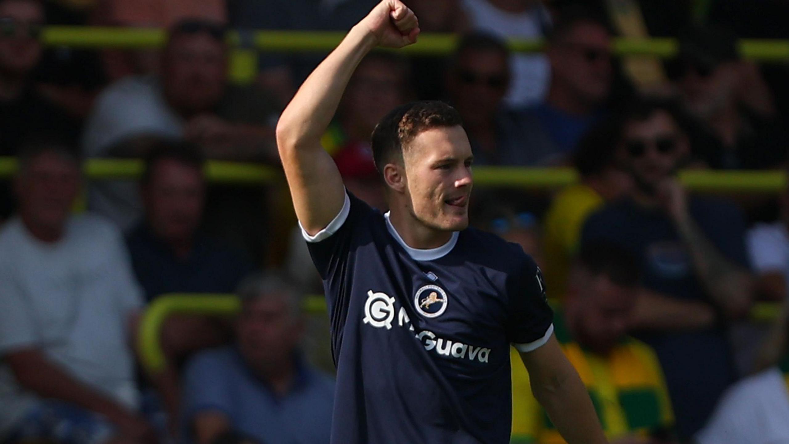 Macaulay Langstaff celebrates with his arm in the air after scoring for Millwall against Norwich City