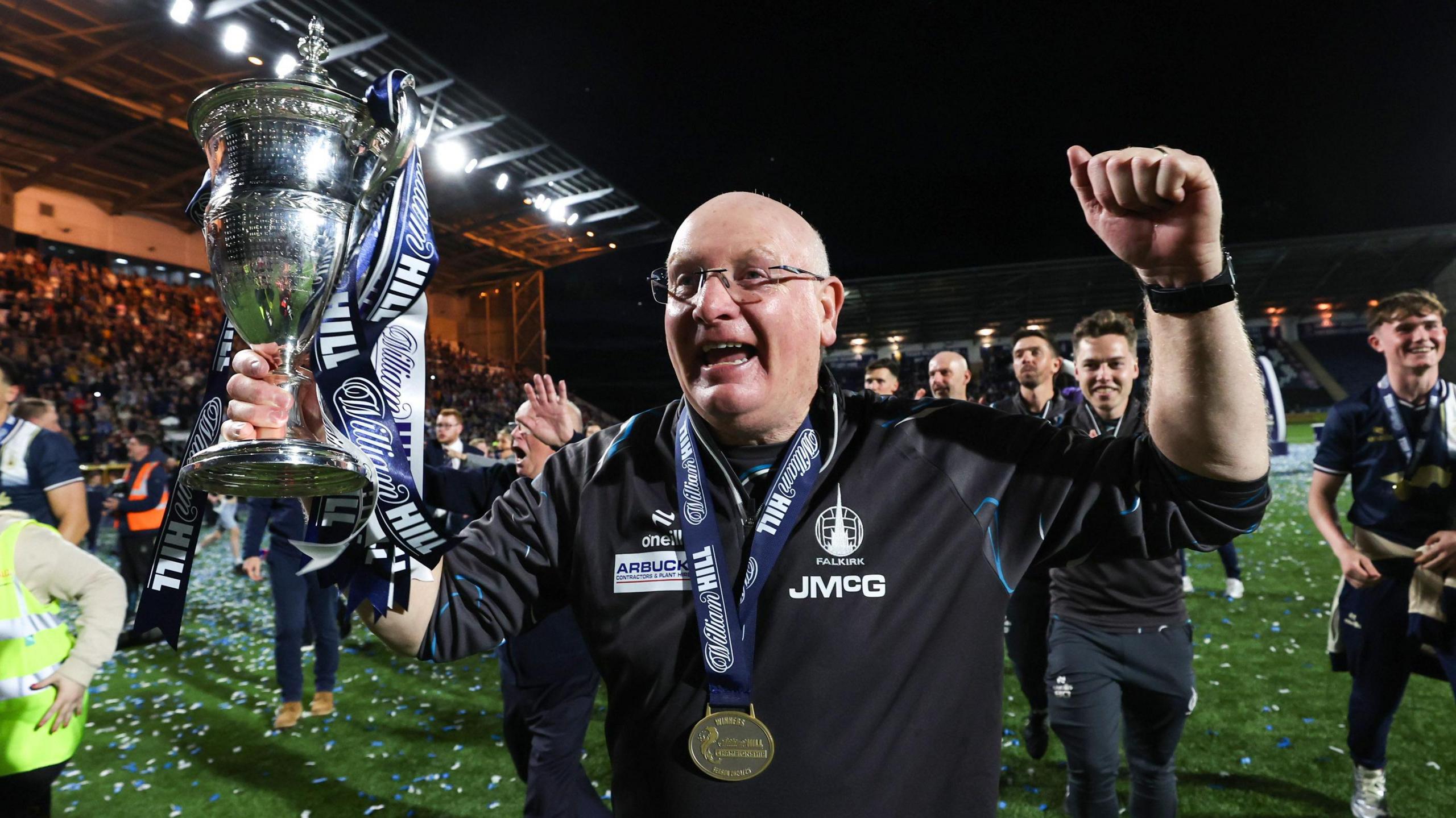 John McGlynn celebrates with the Scottish Championship trophy
