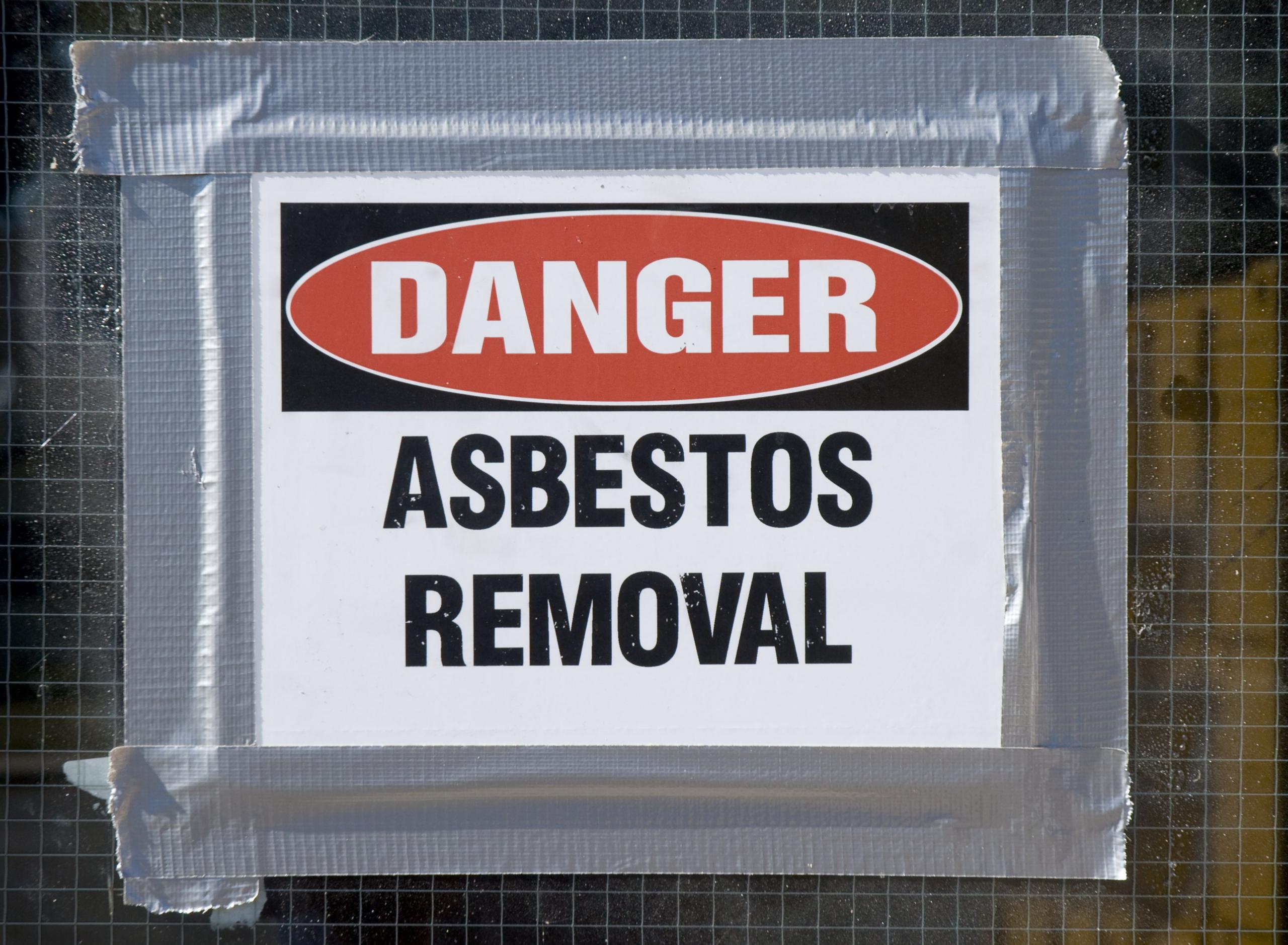 A picture of danger asbestos removal sign