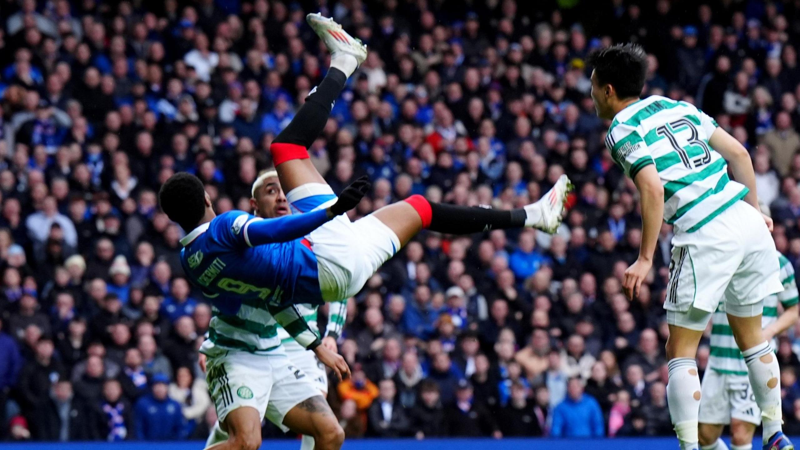 Youssef Chermiti scores for Rangers against Celtic